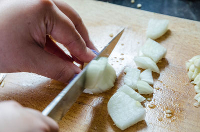 High angle view of person preparing food on cutting board