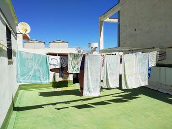 Clothes drying on clothesline against building