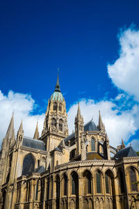 Low angle view of church against blue sky