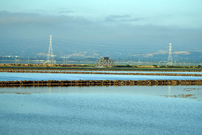 Bridge over sea against sky