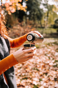 Midsection of person photographing