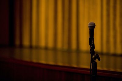 Close-up of wooden wall microphone