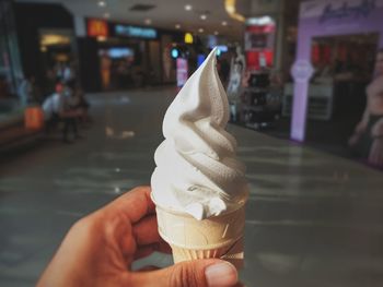 Hand holding ice cream cone