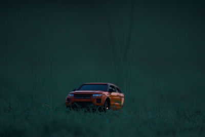 Car on field at night