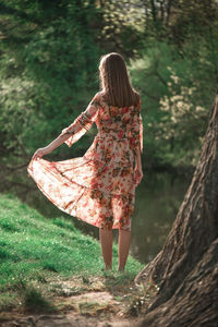 Rear view of woman in forest