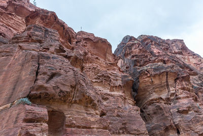 Low angle view of rock formation against sky