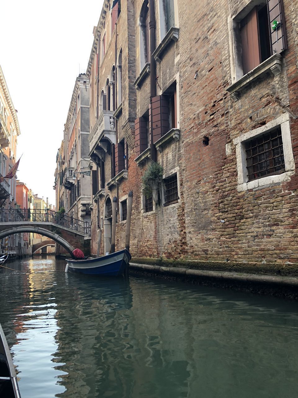 VIEW OF CANAL BY BUILDINGS IN CITY