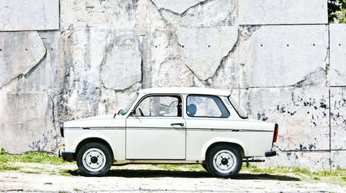 Side view of old vintage car on road