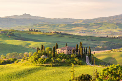 Farm house on a hill in tuscany landscape