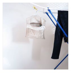 Clothes hanging on wall
