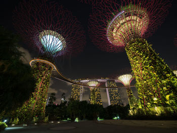 Low angle view of illuminated built structure at night