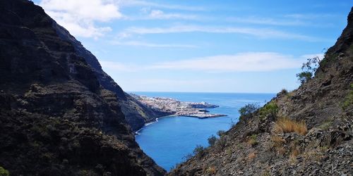 Scenic view of bay against sky