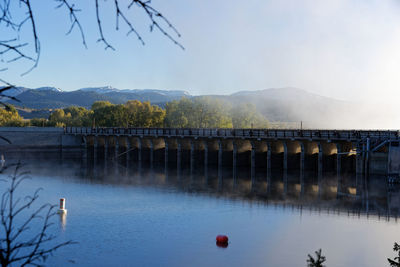 Bridge over river against sky