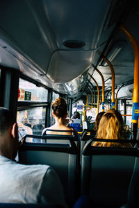 Rear view of people sitting in bus