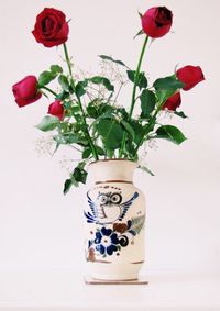 Close-up of vase against white background