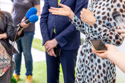 Group of people holding smart phone