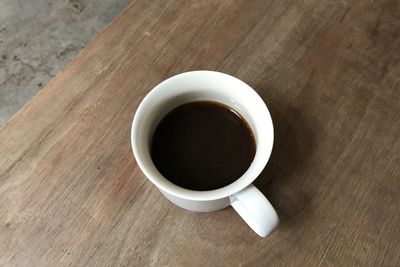 High angle view of black coffee on table