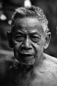 Close-up portrait of shirtless man