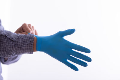 Close-up of man hand over white background