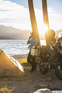 Woman relaxing at camp at the nahuel huapi lake in patagonia