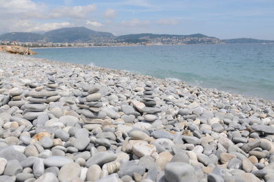 Rocks on beach against sky