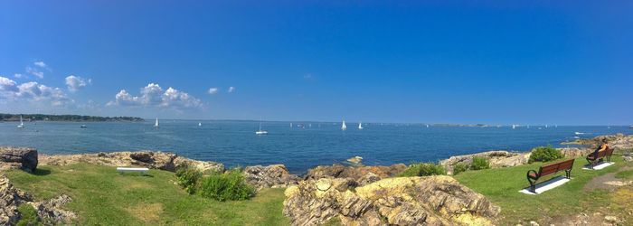 Scenic view of sea against blue sky
