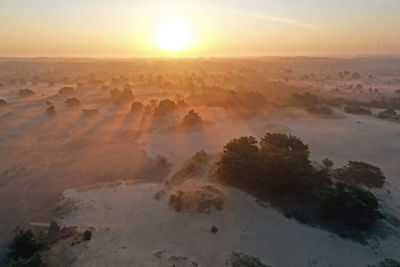 Scenic view of landscape against sky during sunset