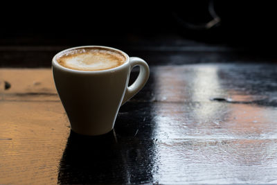 Close-up of coffee cup on table