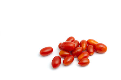 Close-up of tomatoes against white background