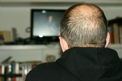 Rear view of man at home