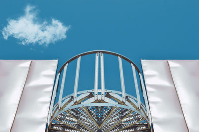 Low angle view of ferris wheel against sky