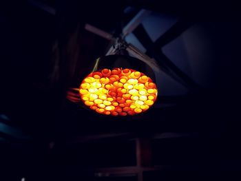 Low angle view of illuminated lantern hanging from ceiling