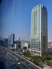 Modern buildings in city against sky