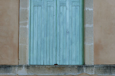 Closed blue door of building