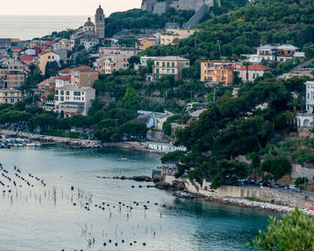 High angle view of townscape by sea