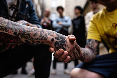 Midsection of person holding camera