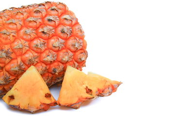 Close-up of cake on plate against white background