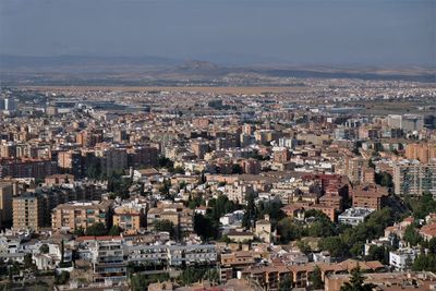 Aerial view of cityscape against sky