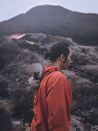 Young man standing on land