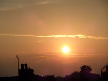 Silhouette of trees against sky during sunset