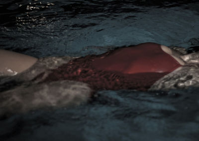 High angle view of woman swimming in pool