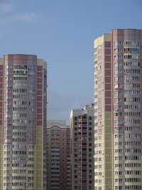 Low angle view of buildings against sky in city