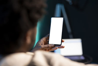 Midsection of woman using mobile phone