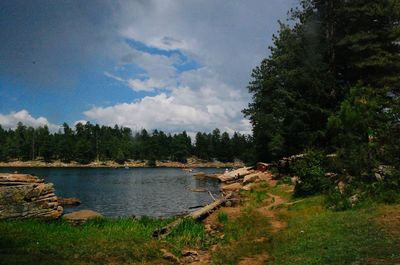 Scenic view of sea against cloudy sky