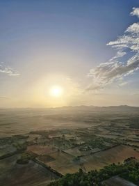 Aerial view of townscape against sky during sunset