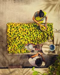 High angle view of man working on cutting board