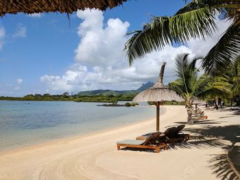 View of beach against cloudy sky