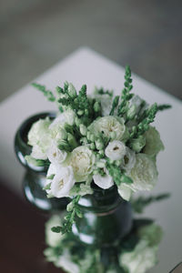 Close-up of white roses on table