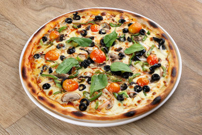 High angle view of pizza in bowl on table