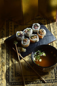 High angle view of sushi served with soup